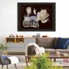 Tableau de 2 portraits de Johnny Hallyday et d'une Harley bleue accroché sur le mur d'un salon